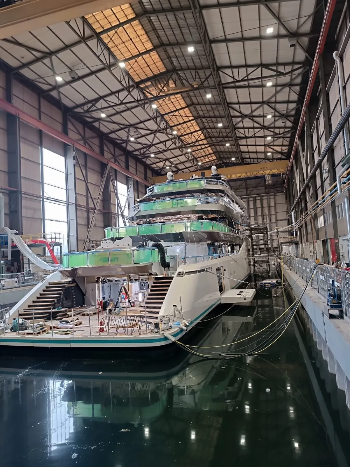 Shipbuilding hall with a vessel under construction