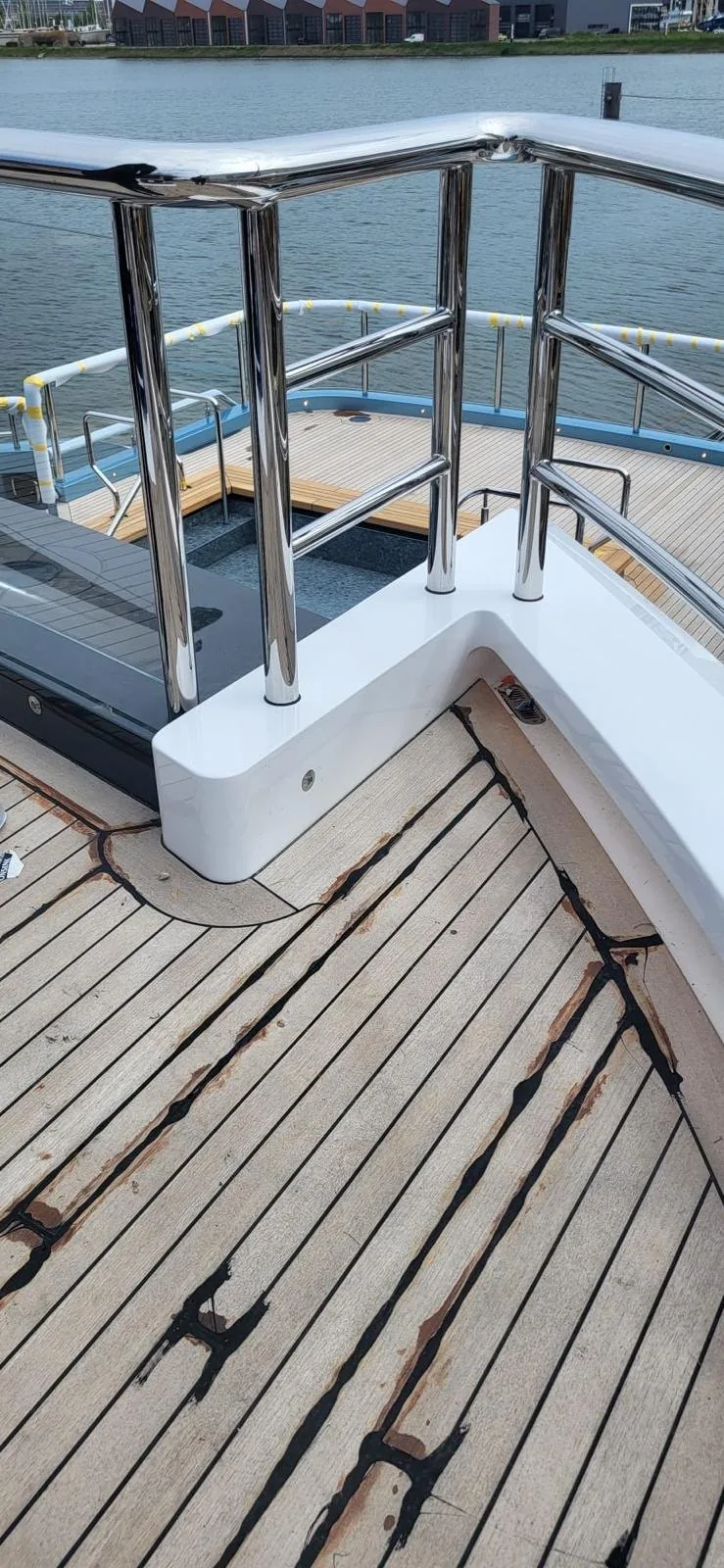 Deck railing detail next to teak decking