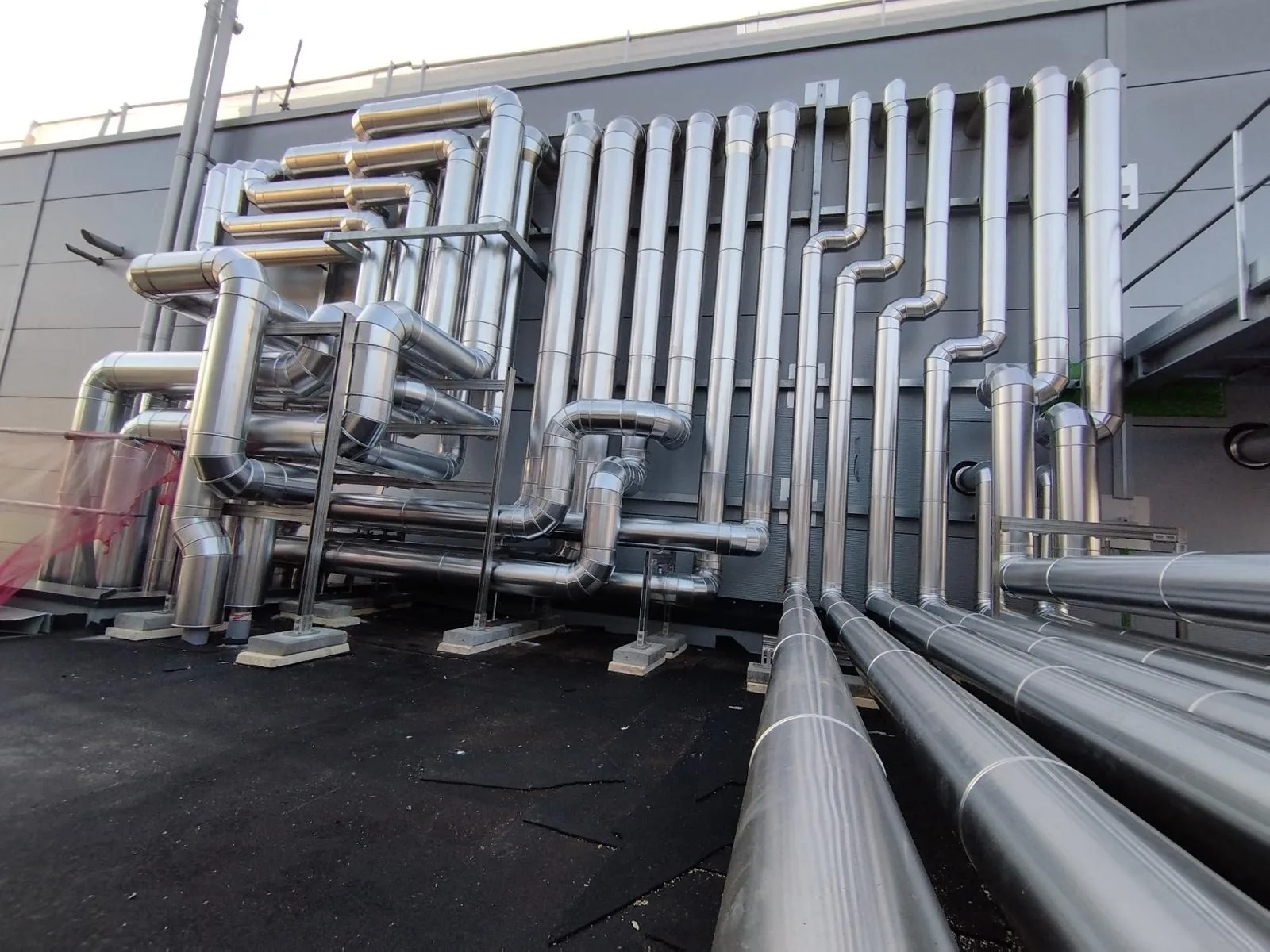 Exterior installation of polished industrial pipework